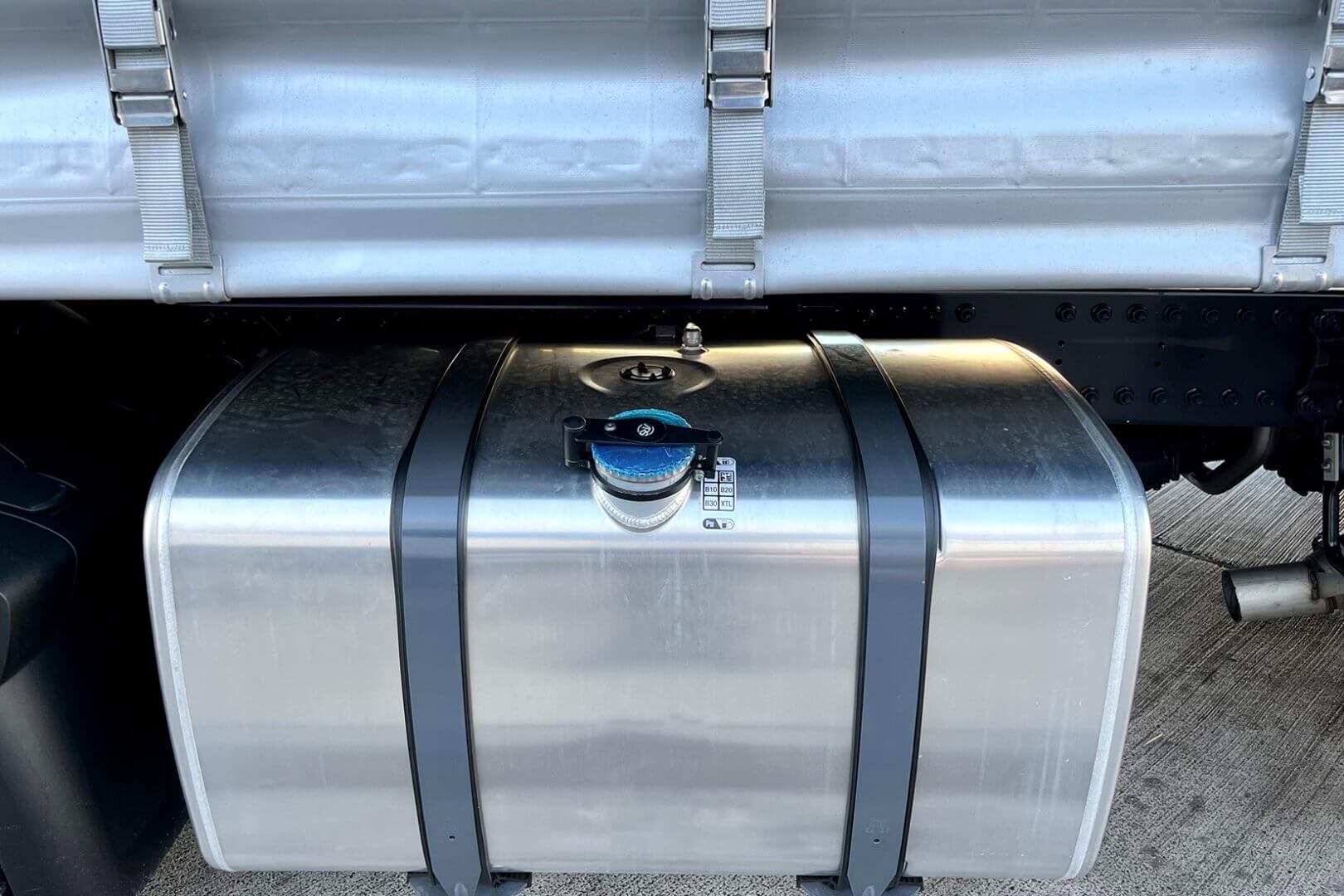 Truck fuel tank with blue cap.