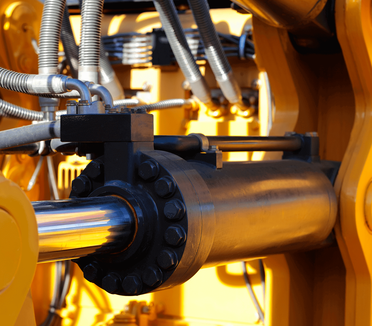 Hydraulic machinery with metal pipes and cylinders.